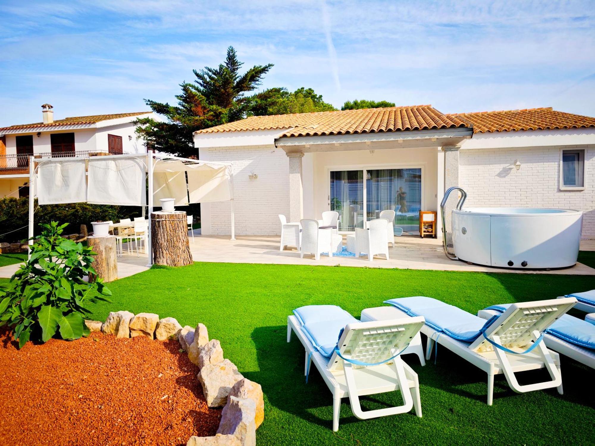 Ikebana Villas Porto Pino Beach Exterior photo